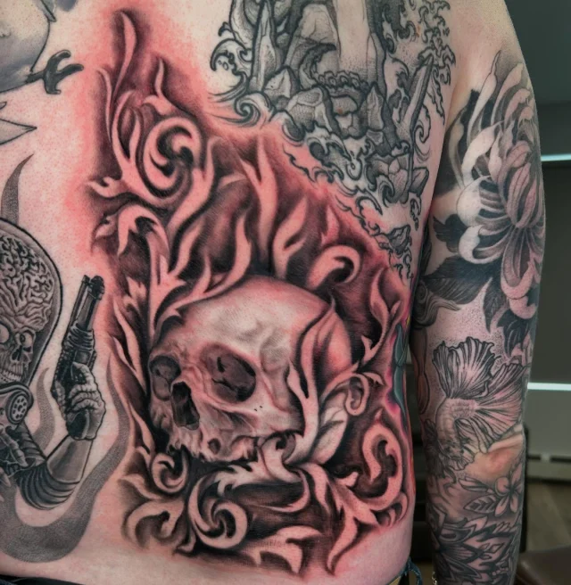 Added another round of filigree to @zritt8 back today!  This is genuinely one of my favorite tattoos I’ve ever done!  Zack’s collection is absolutely incredible!  Im fortunate to be one of the many artists he has pieces from!  Thanks always Zack! 💀🌿